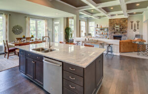 The view of the living room from the kitchen, complete with an island, from CarrHomes home builders in Hamilton.