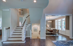 The staircase and dining room from CarrHomes luxury home builders in Hamilton.